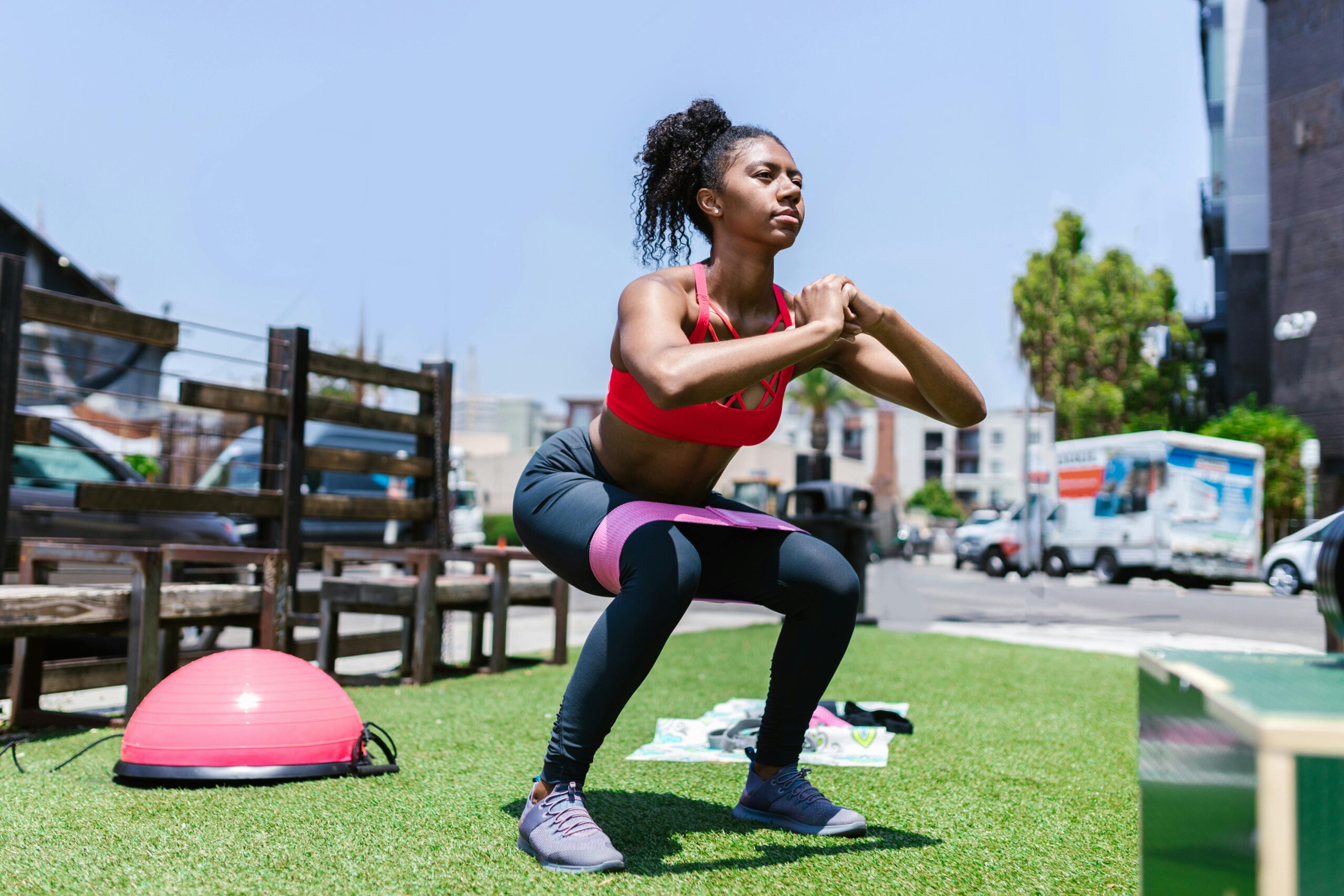Woman performing deep squats exercise showing correct form and muscle engagement
